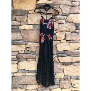 Black lace dress with flower appliqués